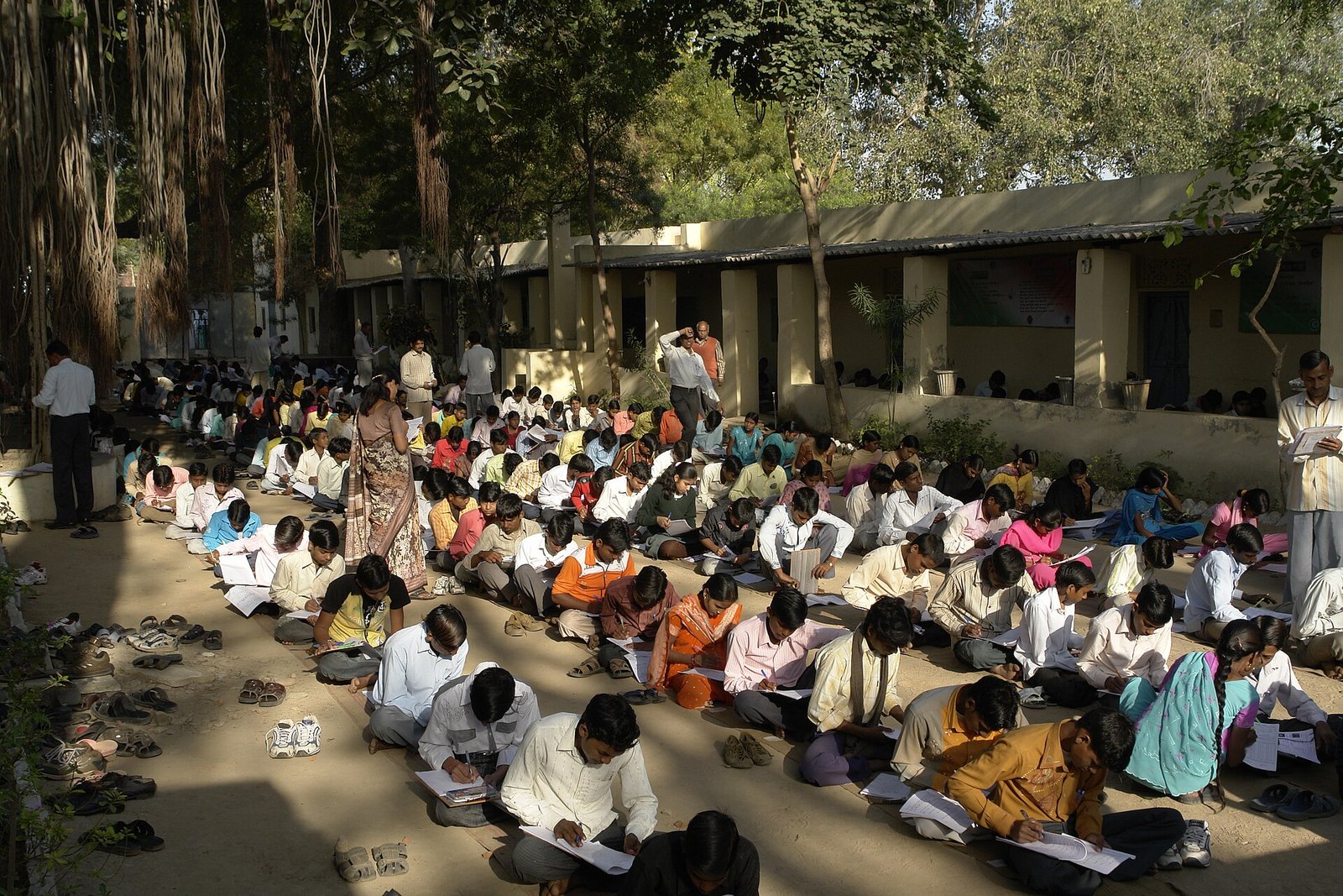 End of the year exams (maths, 10th class) in Mahatma Gandhi Seva Ashram, Jaura, India. All the students are grouped on a compound out of …